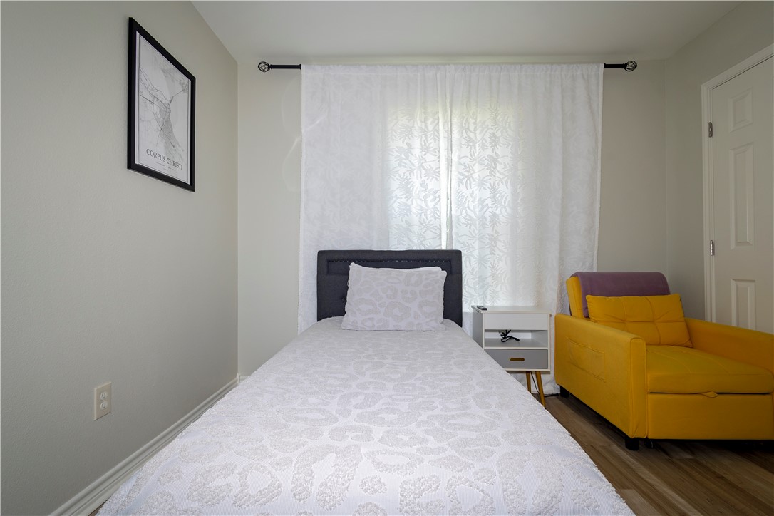 1217 O'Connell Street Corpus Christi, TX 78418 - Photo 11 of 23 a bedroom with a bed and a couch