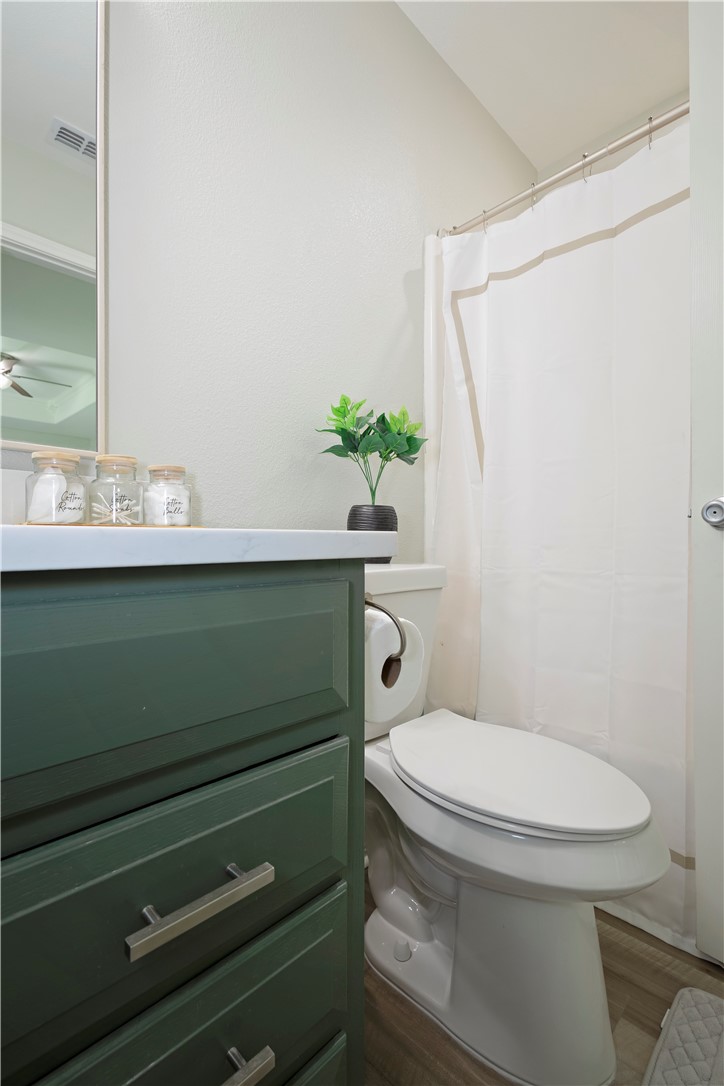 1217 O'Connell Street Corpus Christi, TX 78418 - Photo 13 of 23 a bathroom with a sink a toilet and a mirror