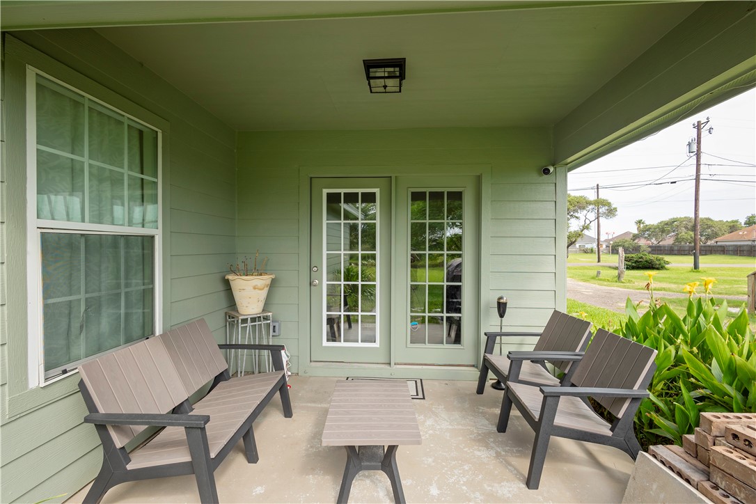 1217 O'Connell Street Corpus Christi, TX 78418 - Photo 20 of 23 a balcony with couple of chairs and a couch