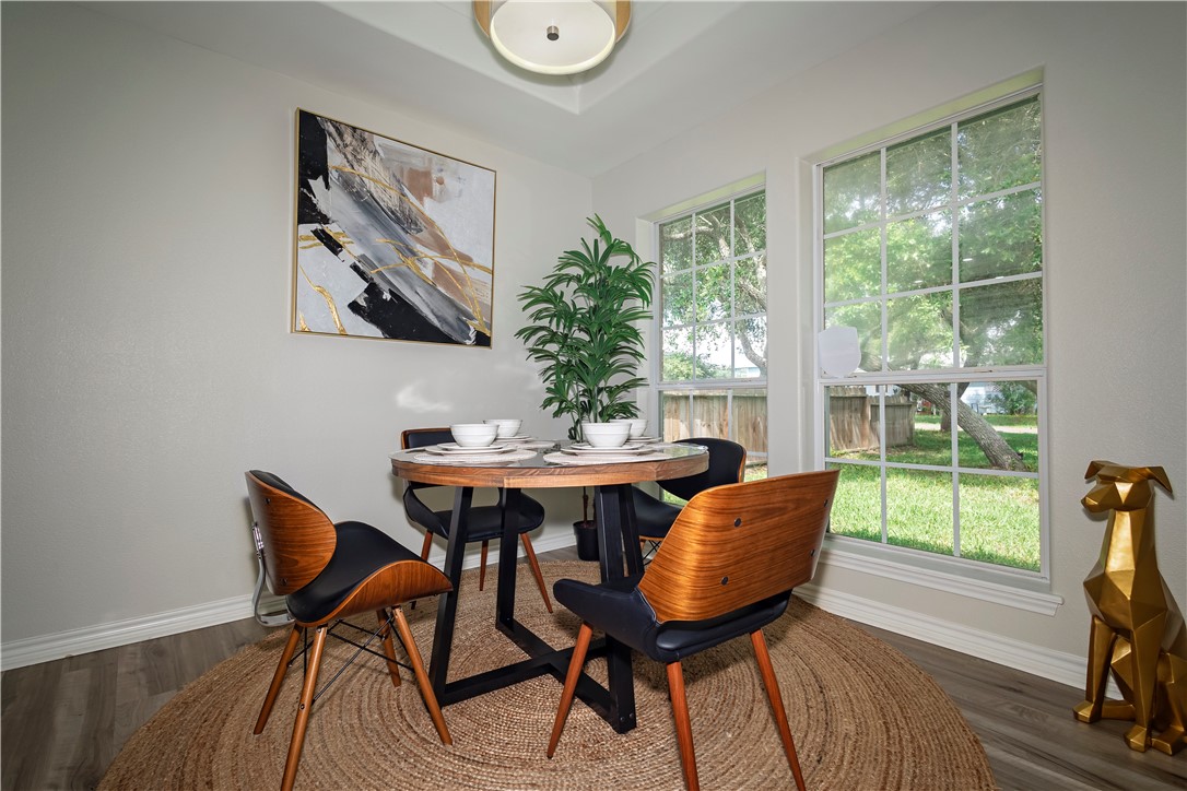 1217 O'Connell Street Corpus Christi, TX 78418 - Photo 4 of 23 a view of a dining room with furniture and a window