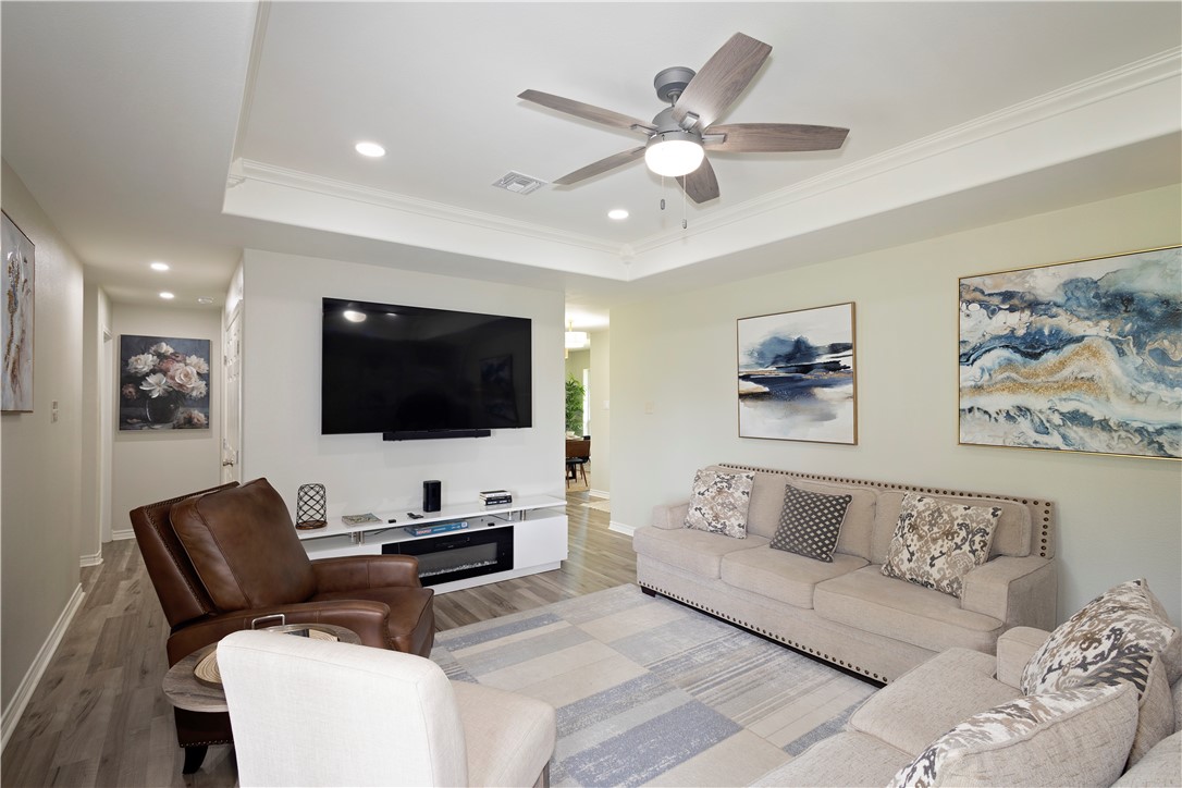 1217 O'Connell Street Corpus Christi, TX 78418 - Photo 8 of 23 a living room with furniture and a flat screen tv