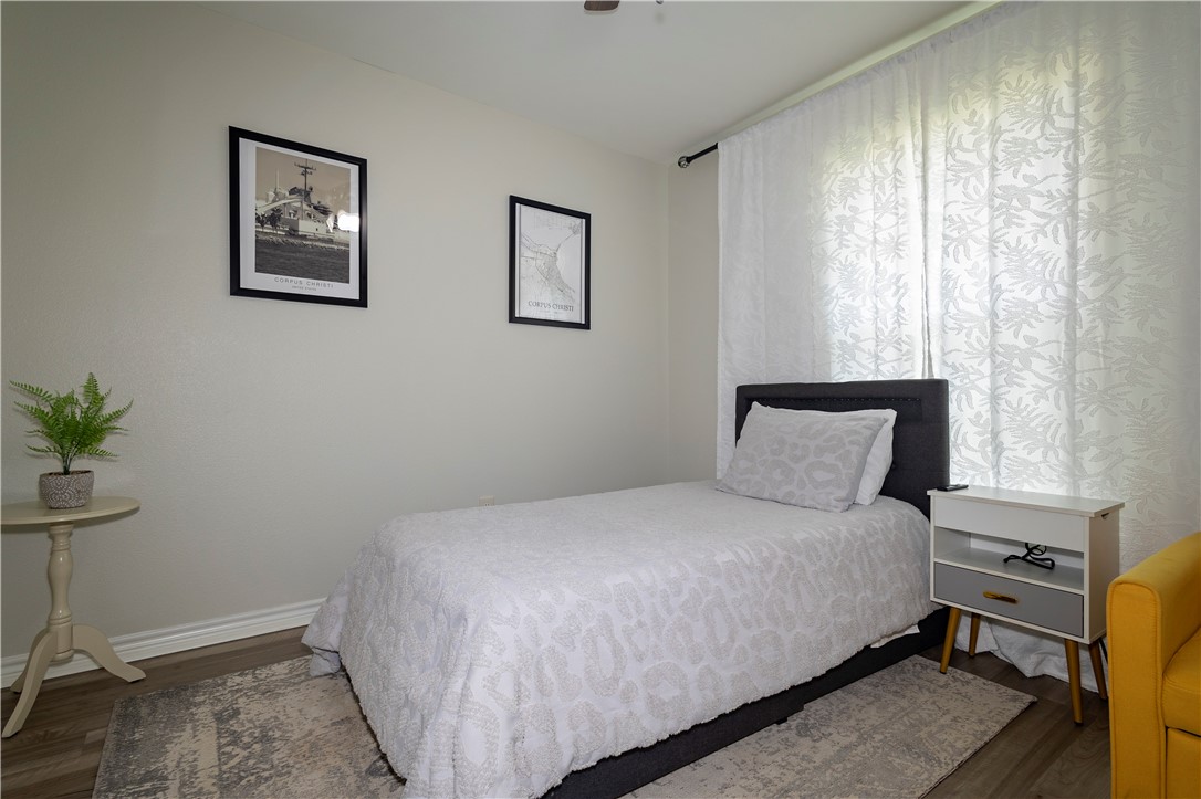 1217 O'Connell Street Corpus Christi, TX 78418 - Photo 10 of 23 a bedroom with a bed and a potted plant