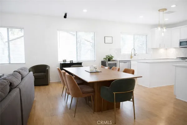 a view of a dining room with furniture and window