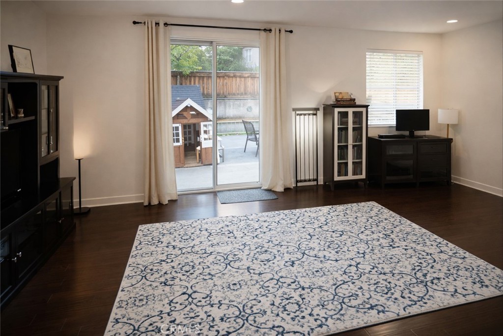 4689 Brookmore Court Riverside, CA 92505 - Photo 7 of 10 a living room with stainless steel appliances kitchen island granite countertop a refrigerator and a sink