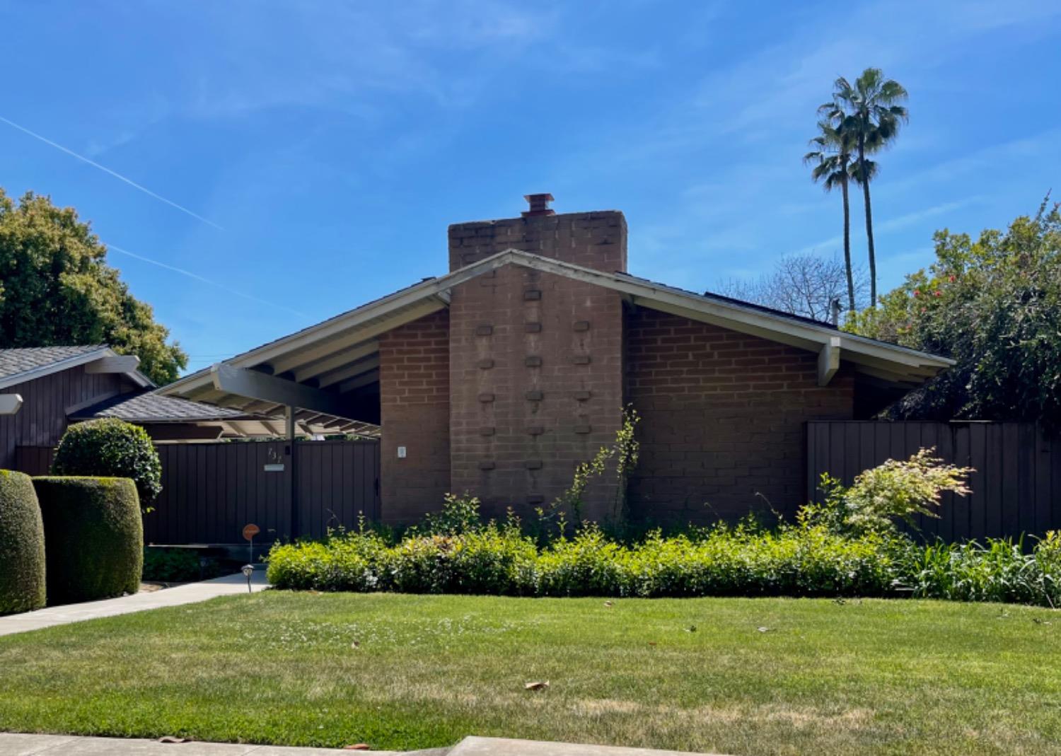 737 West Rialto Avenue Fresno, CA 93705 - Photo 1 of 11 a front view of a house with a garden