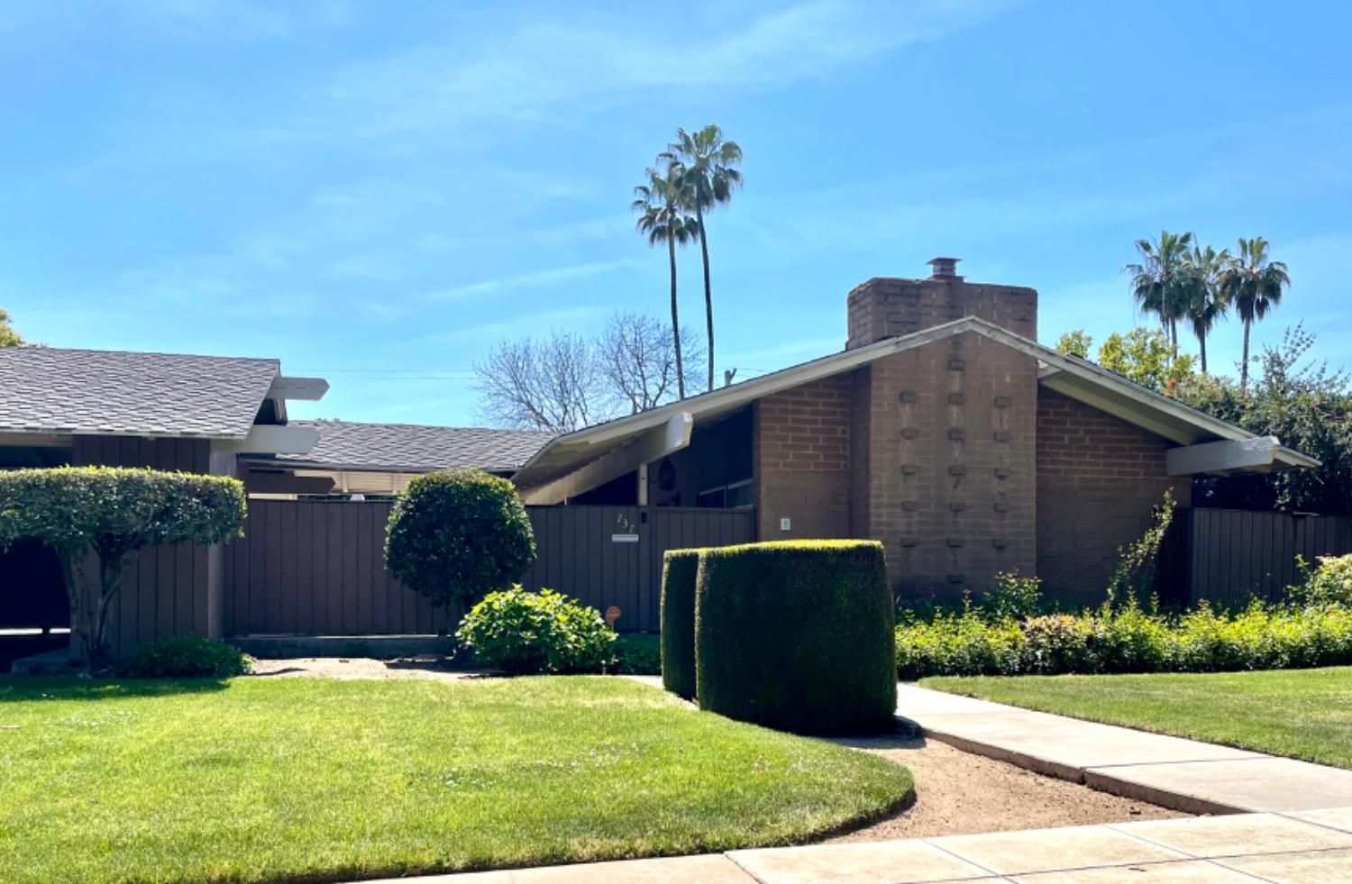 737 West Rialto Avenue Fresno, CA 93705 - Photo 2 of 11 a view of a house with a yard and plants