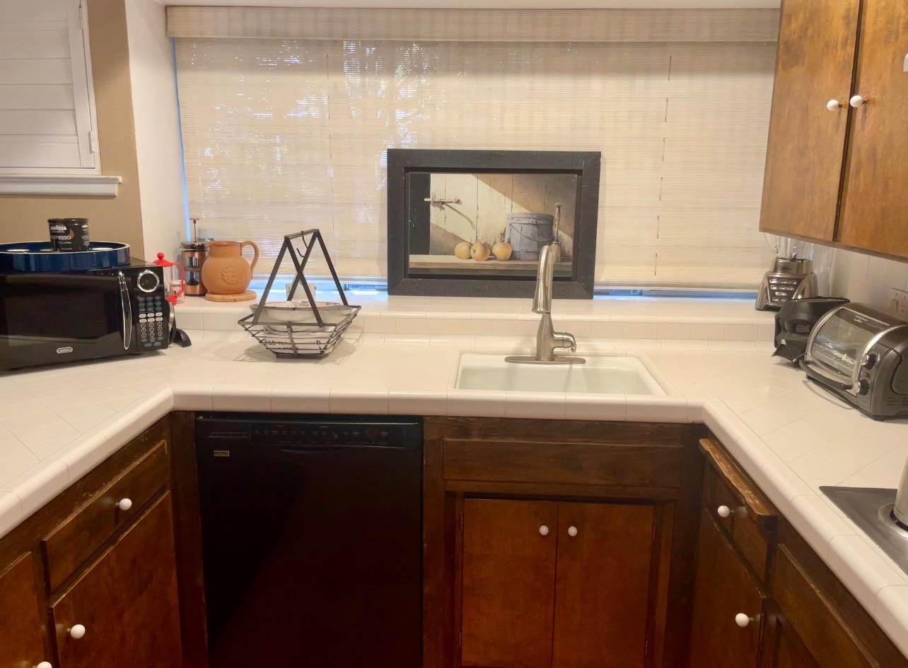 737 West Rialto Avenue Fresno, CA 93705 - Photo 6 of 11 a bathroom with a sink and a mirror