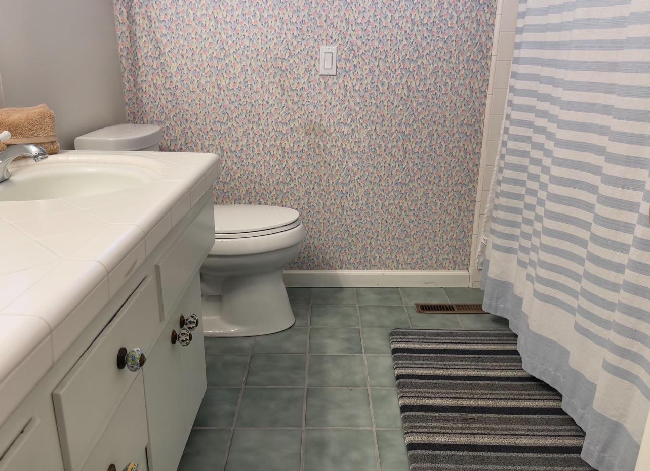 737 West Rialto Avenue Fresno, CA 93705 - Photo 10 of 11 a bathroom with a toilet and a sink