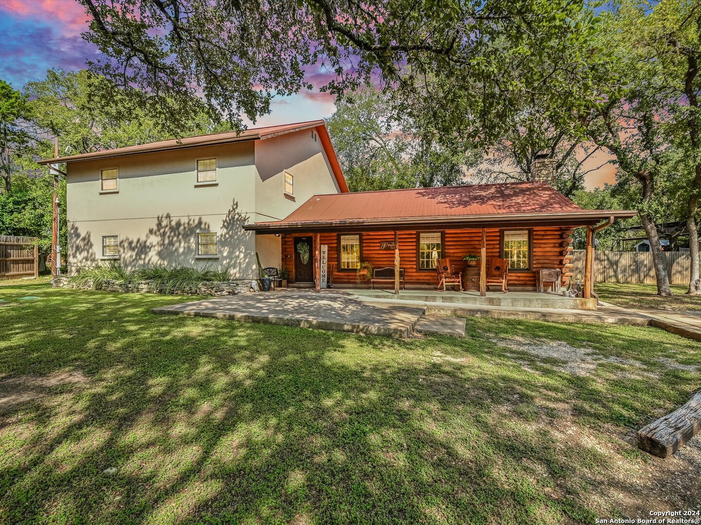 331 Rhodes Lane Wimberley, TX 78676 - Photo 1 of 1 a front view of a house with garden
