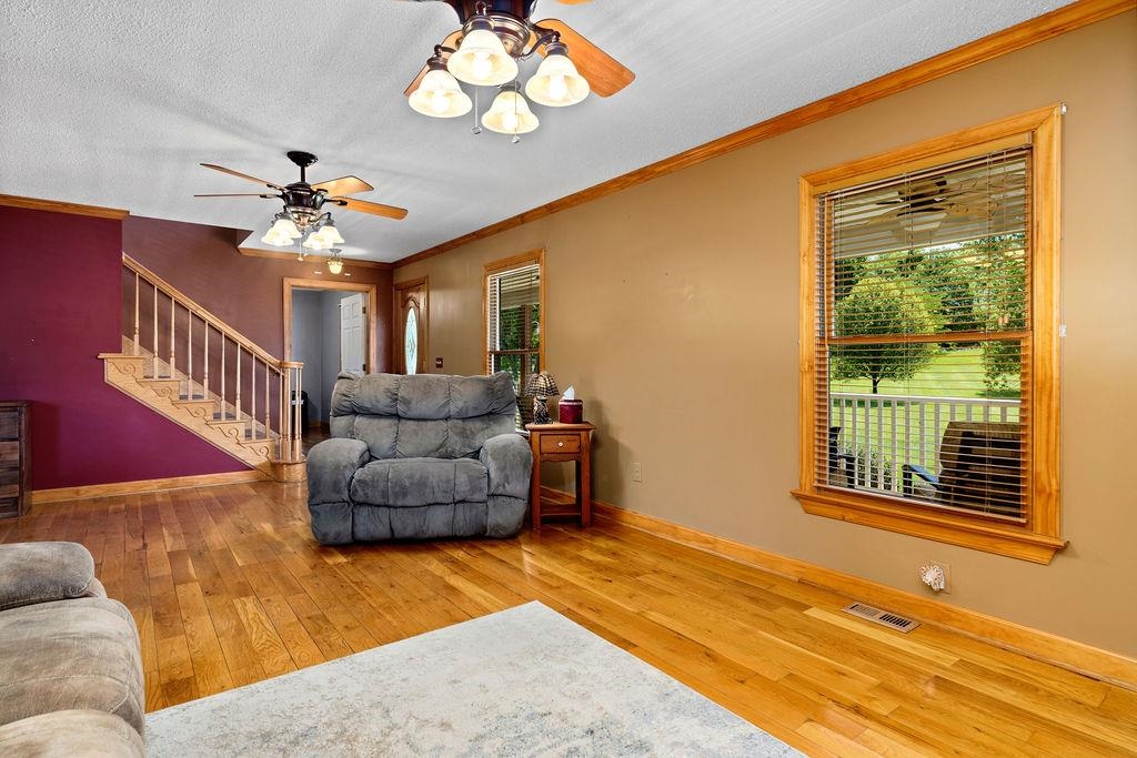 1476 Guthrie Road Staunton, VA 24401 - Photo 24 of 73 a living room with furniture and a chandelier
