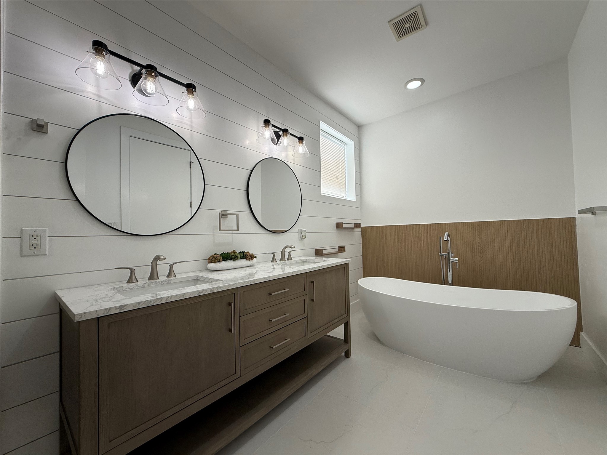 1608 Patterson Street, Unit A Houston, TX 77007 - Photo 14 of 20 a spacious bathroom with a double vanity sink and a mirror