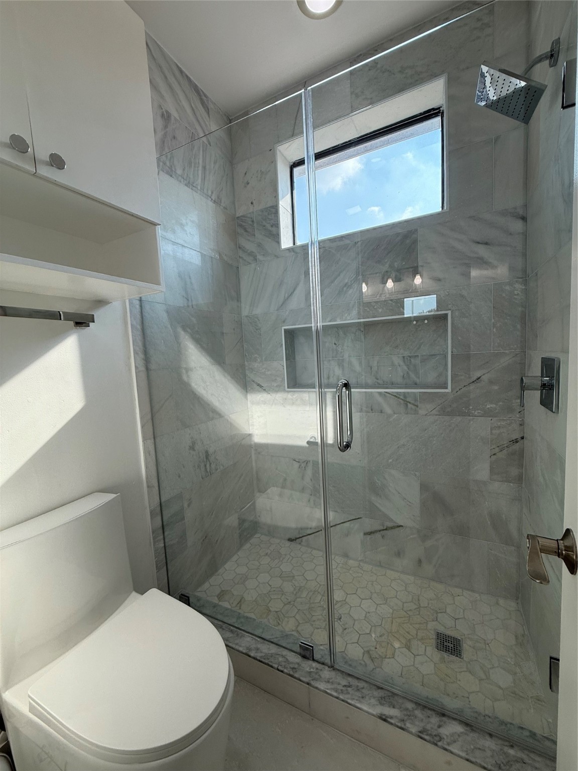 1608 Patterson Street, Unit A Houston, TX 77007 - Photo 20 of 20 a white toilet next to a bathroom sink