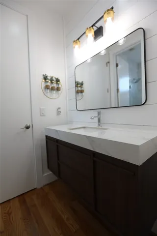 a white toilet next to a bathroom sink