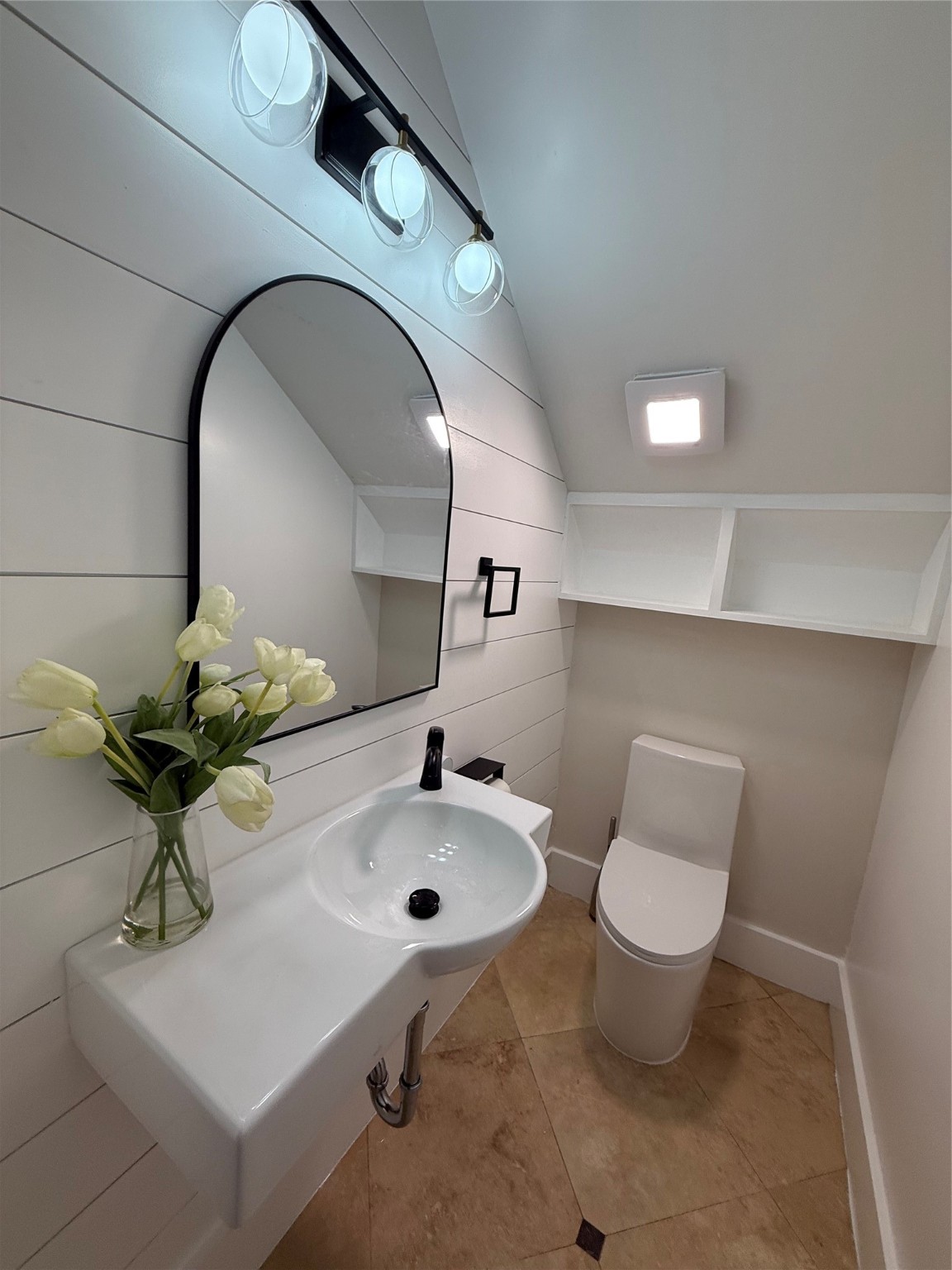 1608 Patterson Street, Unit A Houston, TX 77007 - Photo 7 of 20 a bathroom with a toilet sink and mirror