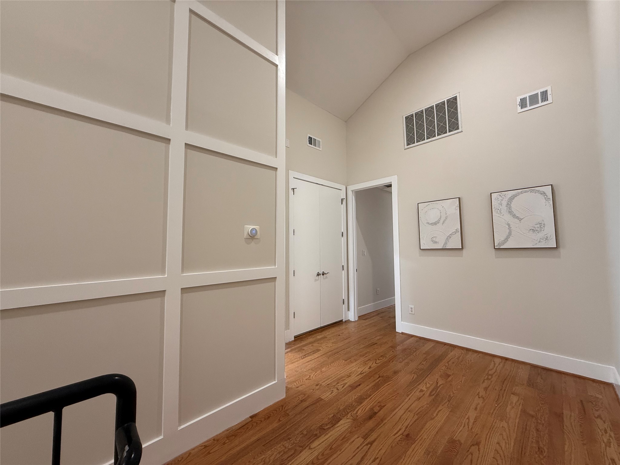 1608 Patterson Street, Unit A Houston, TX 77007 - Photo 9 of 20 a view of an empty room with wooden floor