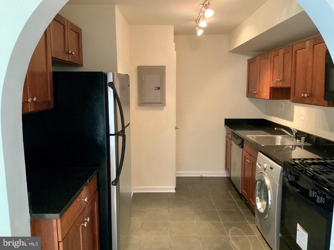 3109 Naylor Road Southeast, Unit C Washington, DC 20020 - Photo 12 of 20 a kitchen with a refrigerator stove and a sink