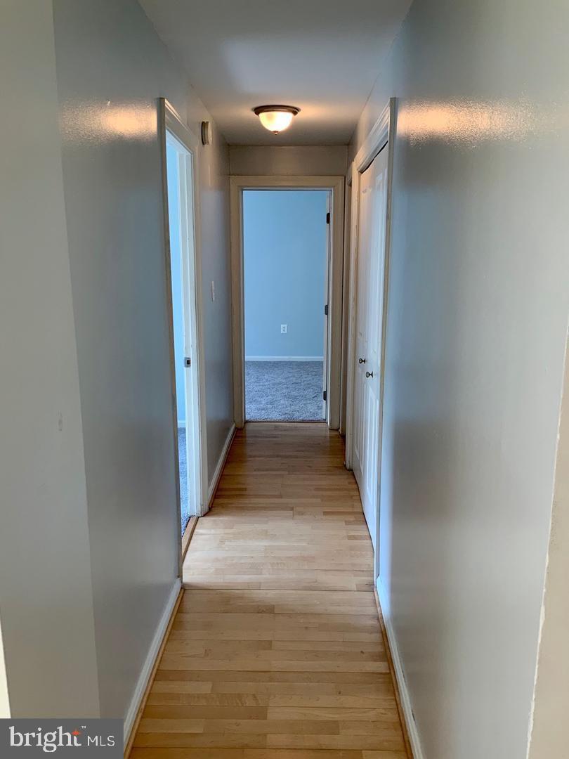 3109 Naylor Road Southeast, Unit C Washington, DC 20020 - Photo 13 of 20 a view of a hallway with wooden floor