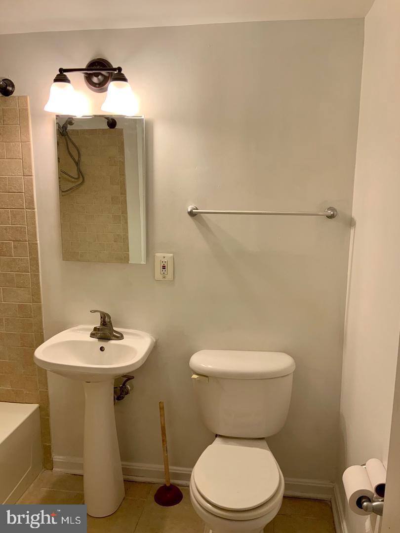 3109 Naylor Road Southeast, Unit C Washington, DC 20020 - Photo 17 of 20 a bathroom with a sink toilet and mirror