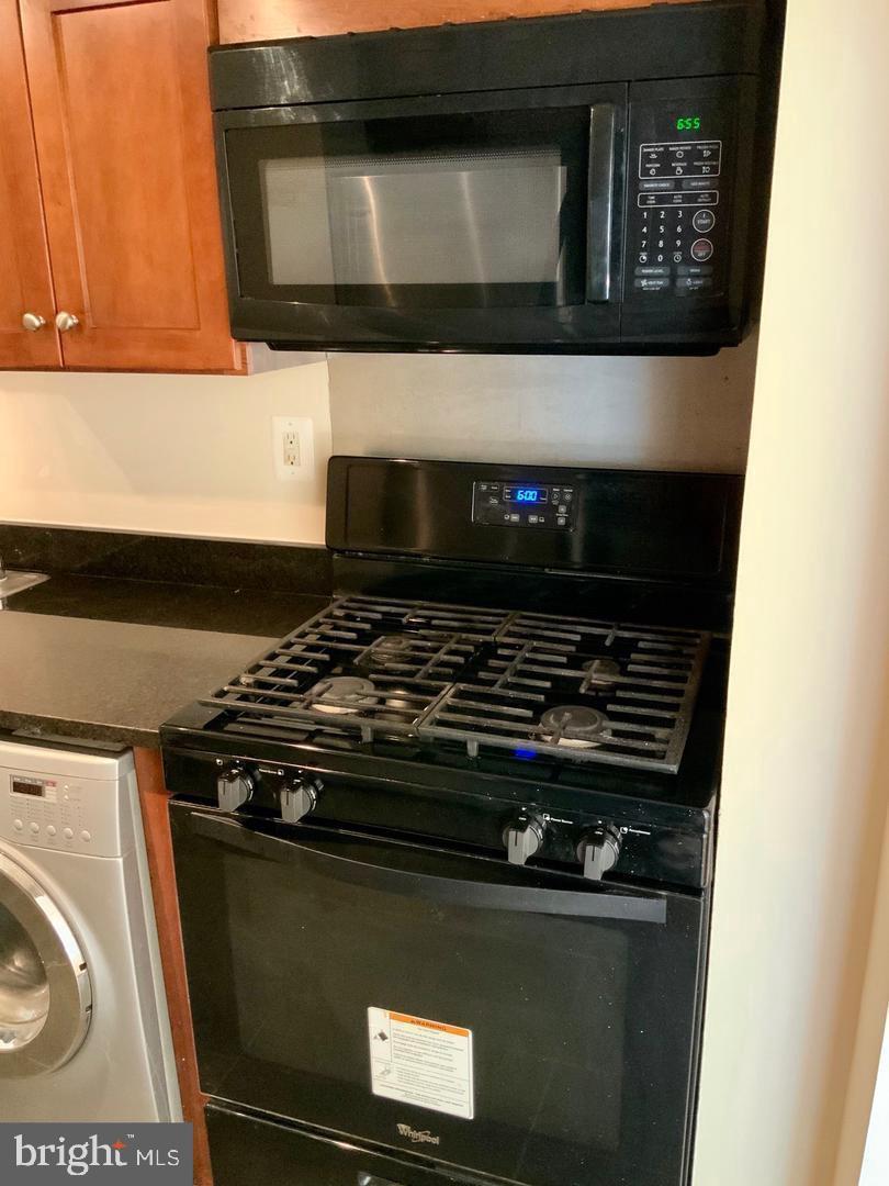 3109 Naylor Road Southeast, Unit C Washington, DC 20020 - Photo 7 of 20 a stove top oven sitting inside of a kitchen