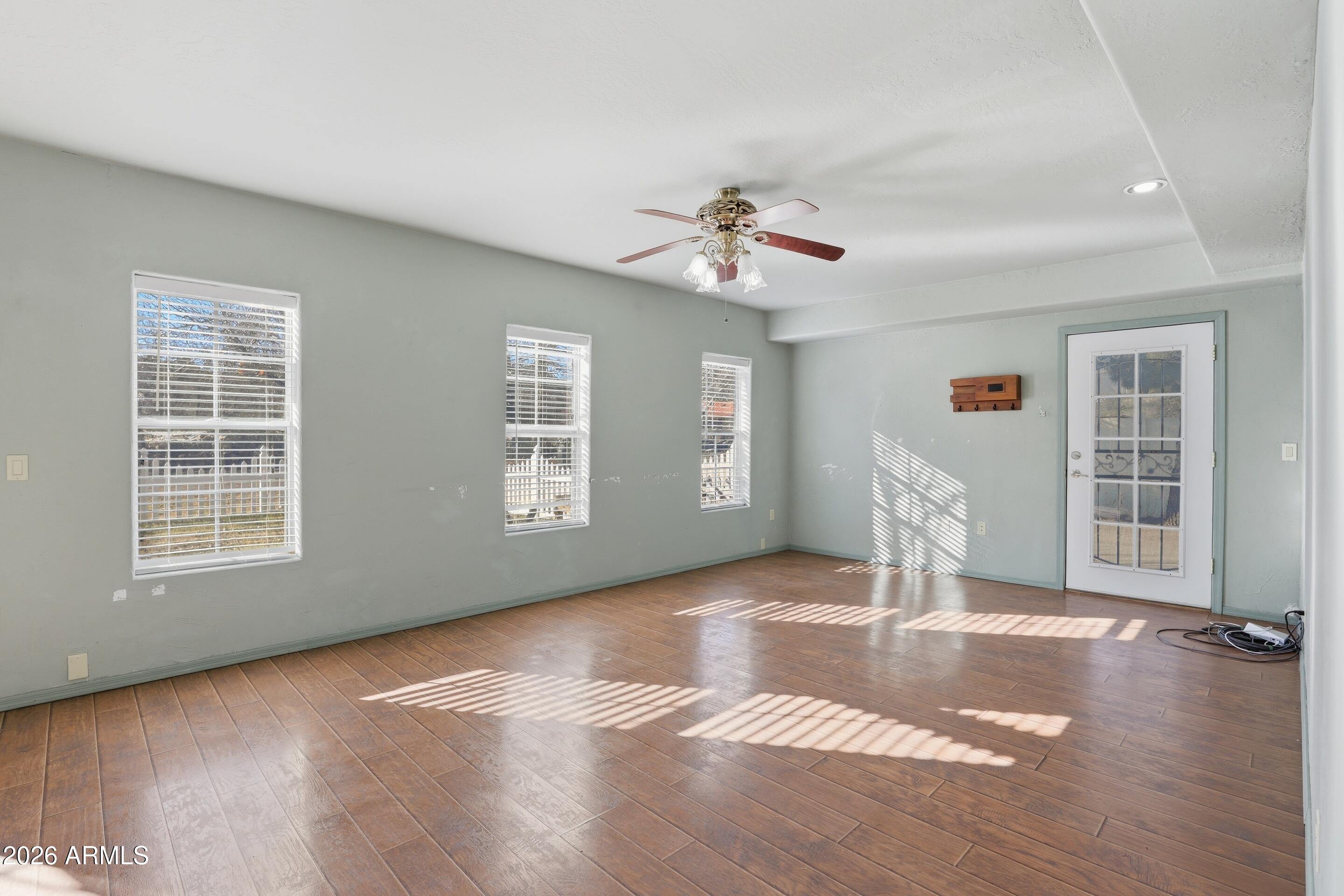 228 Windmill Road Payson, AZ 85541 - Photo 20 of 42 a view of livingroom with hardwood floor and a ceiling fan