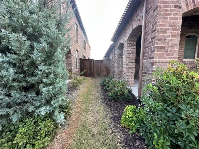 3942 Rochelle Lane Crandall, TX 75114 - Photo 3 of 20 a view of a pathway both side of house