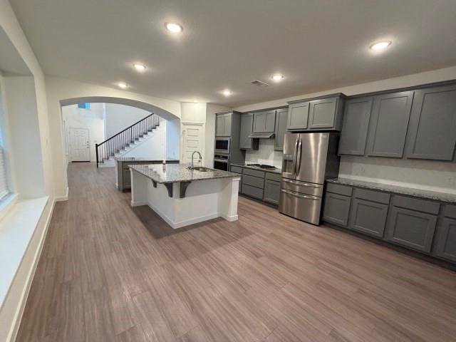 3942 Rochelle Lane Crandall, TX 75114 - Photo 8 of 20 a kitchen with stainless steel appliances a refrigerator and a stove top oven
