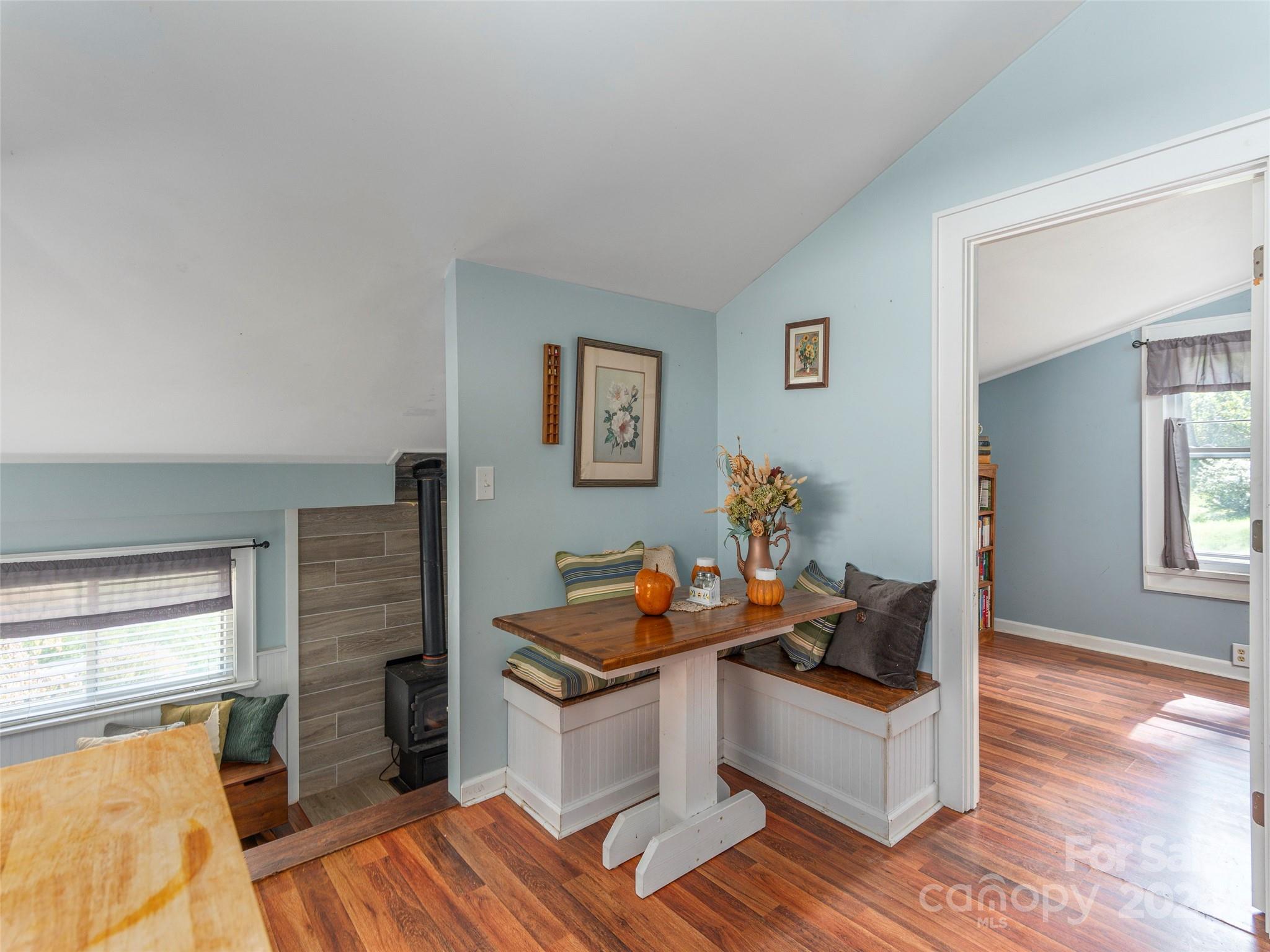883 Price Town Road Clyde, NC 28721 - Photo 11 of 34 a living room with furniture and a fireplace