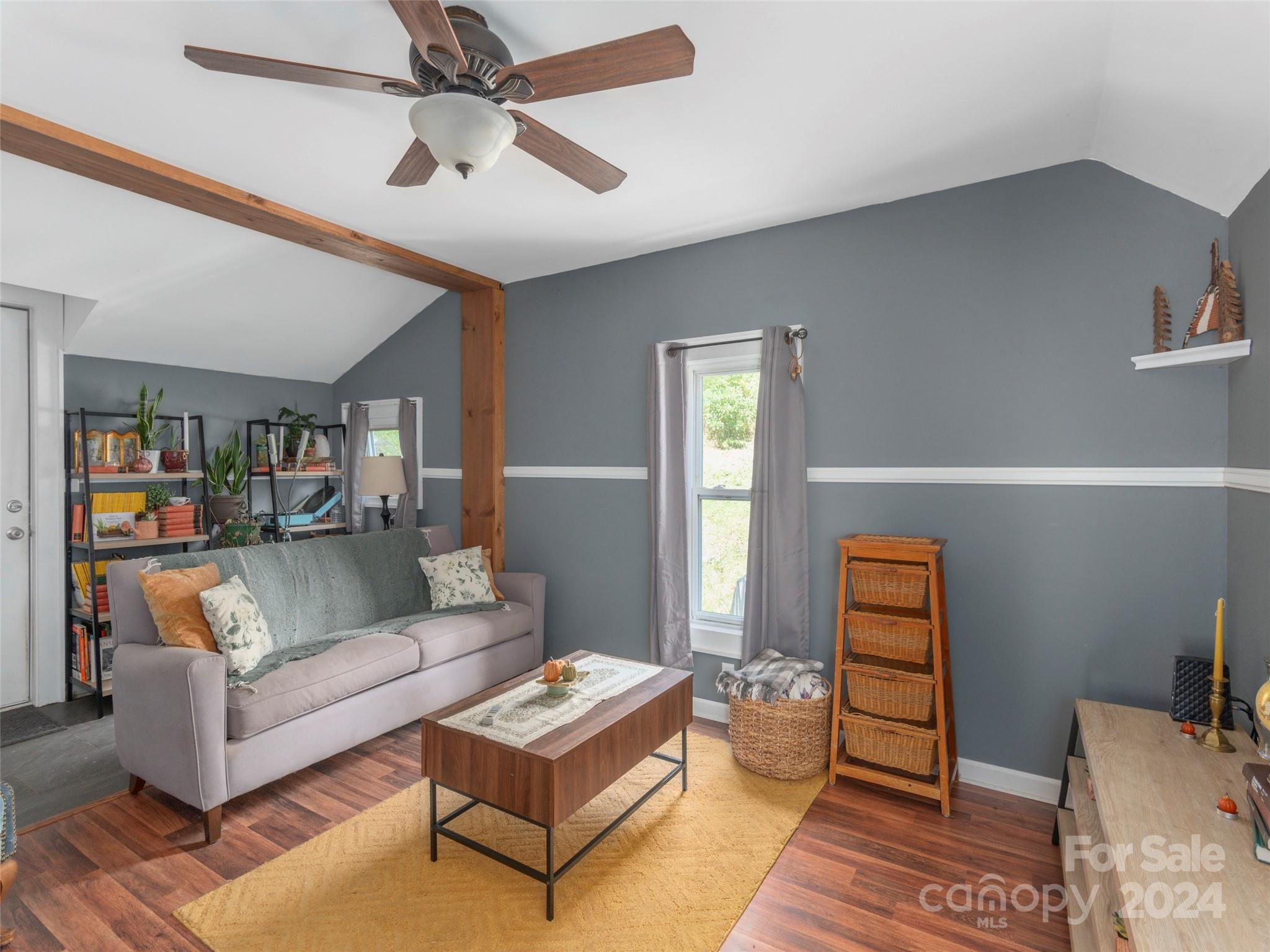883 Price Town Road Clyde, NC 28721 - Photo 14 of 34 a living room with furniture and a wooden floor