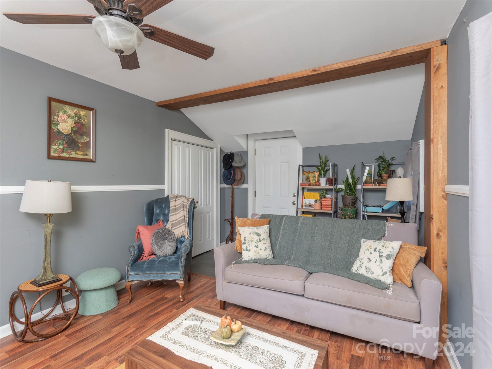 883 Price Town Road Clyde, NC 28721 - Photo 15 of 34 a living room with furniture and a wooden floor