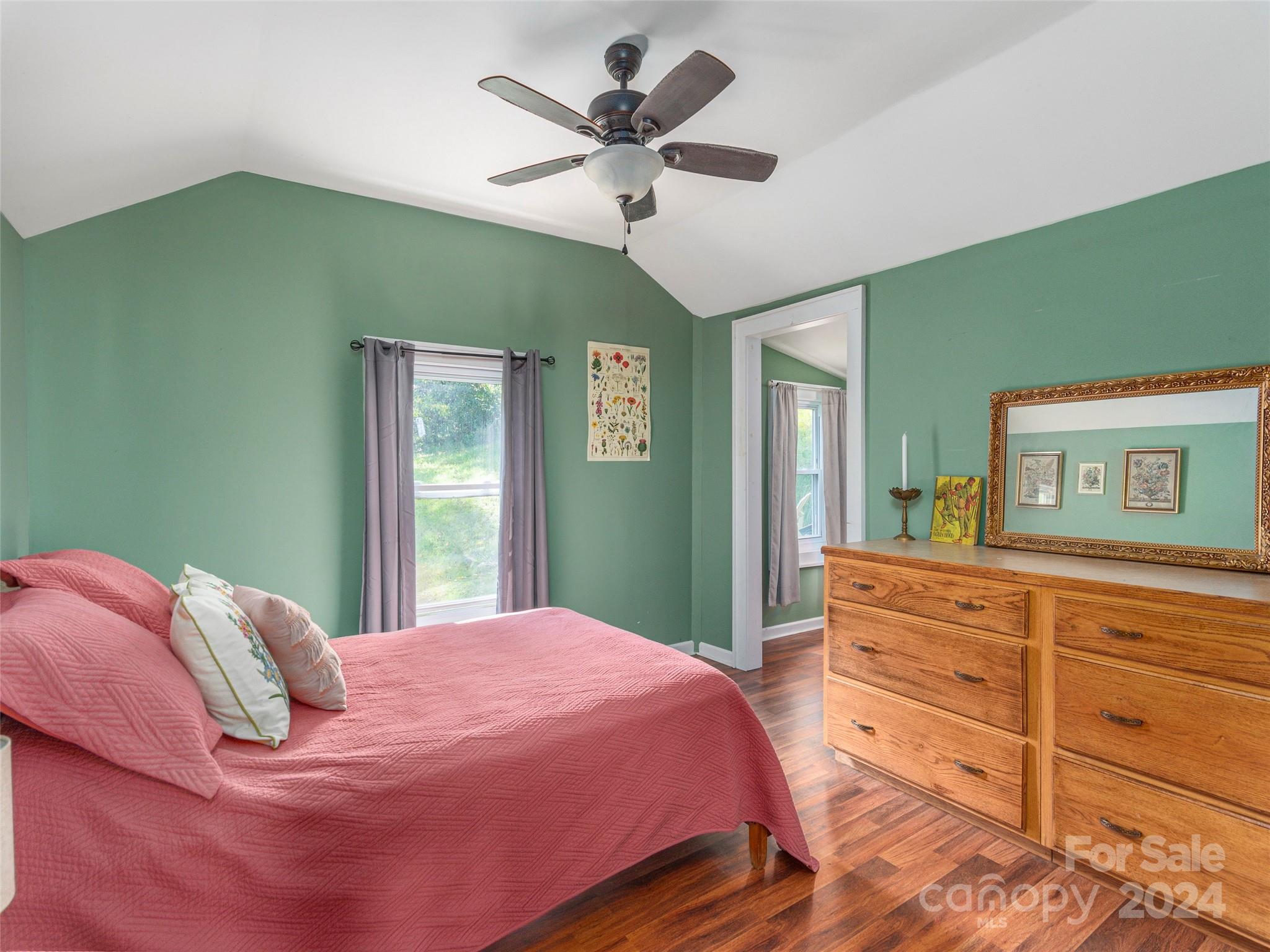 883 Price Town Road Clyde, NC 28721 - Photo 17 of 34 a bedroom with a bed and a dresser
