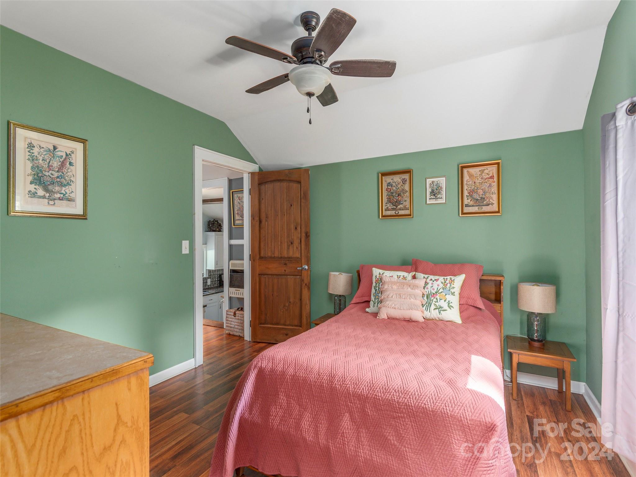 883 Price Town Road Clyde, NC 28721 - Photo 18 of 34 a bedroom with a bed and a table