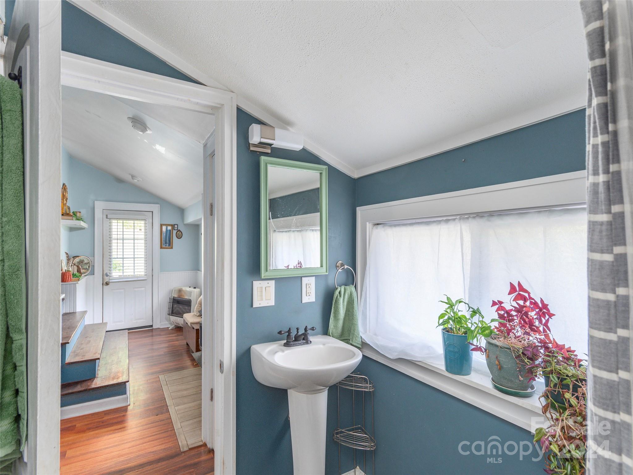 883 Price Town Road Clyde, NC 28721 - Photo 20 of 34 a view of a room with furniture and flowers