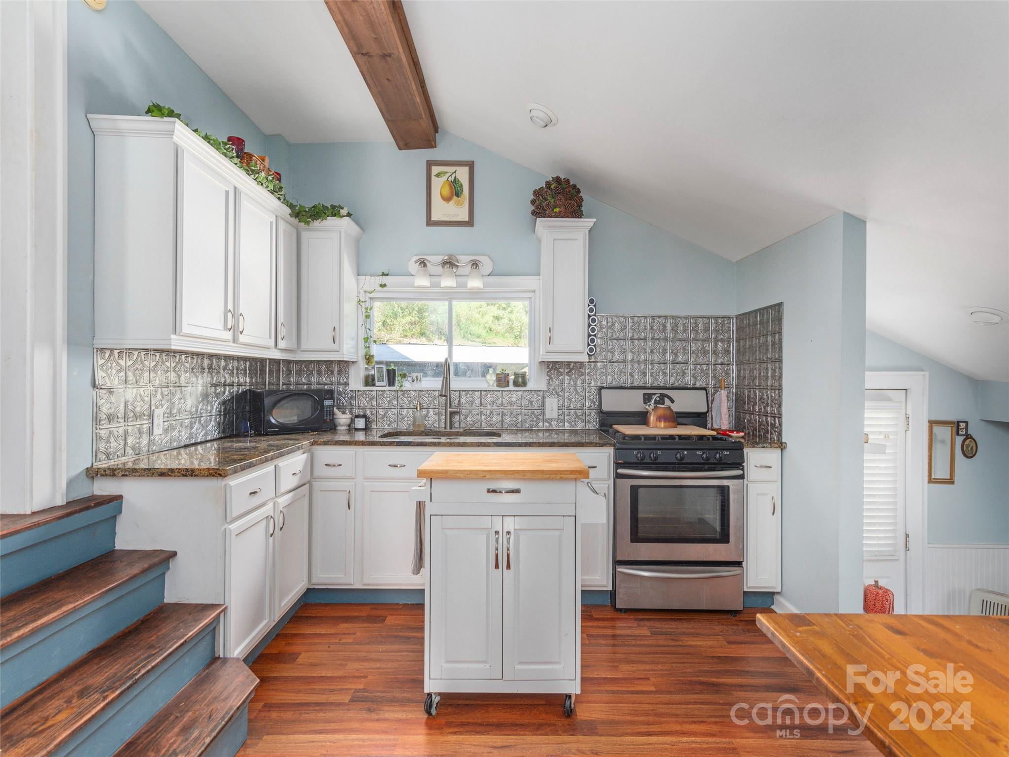883 Price Town Road Clyde, NC 28721 - Photo 5 of 34 a large kitchen with stainless steel appliances granite countertop a stove and a sink