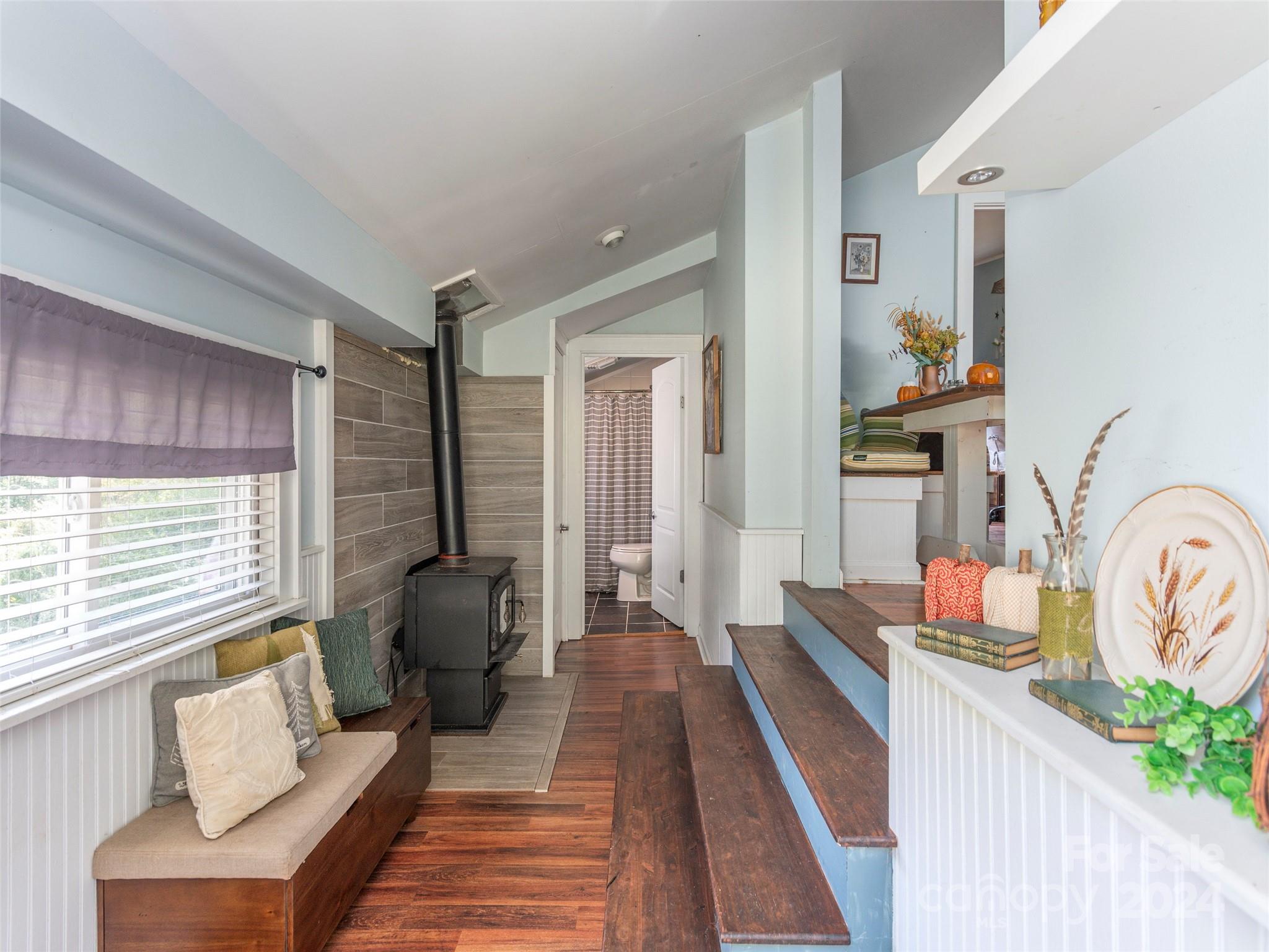 883 Price Town Road Clyde, NC 28721 - Photo 9 of 34 a living room with furniture and a window