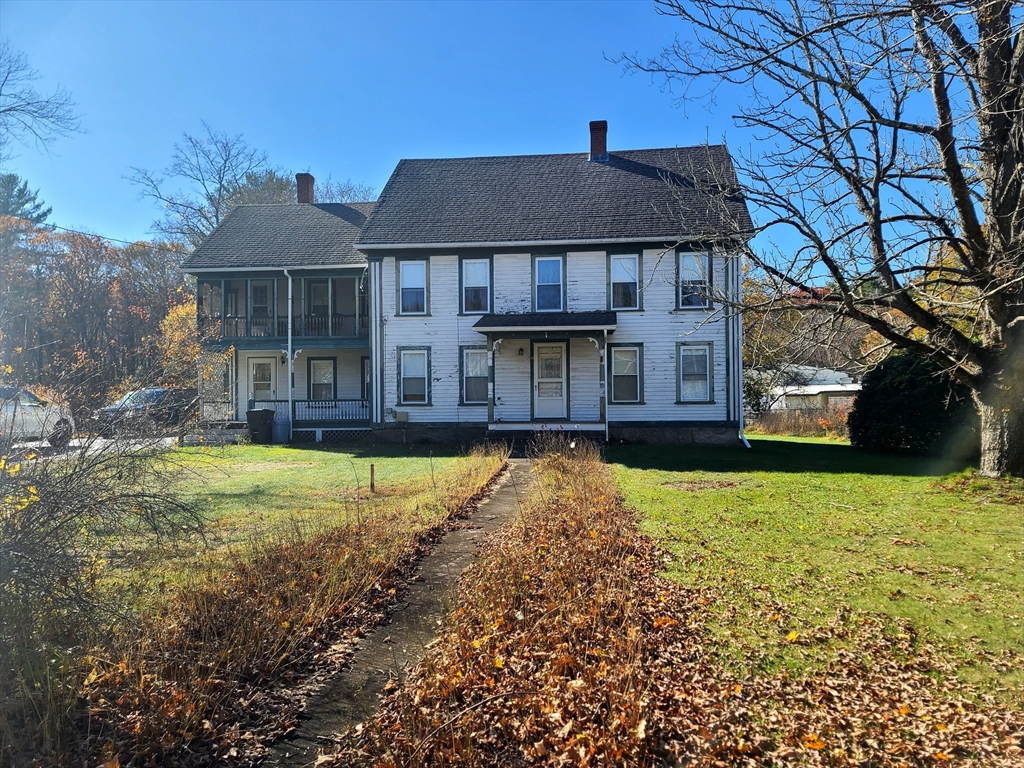10 Maple Avenue Grafton, MA 01560 - Photo 2 of 9 a front view of a house with a yard