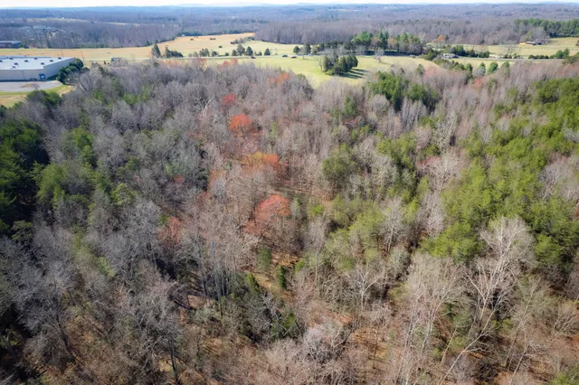 an aerial view of houses with yard