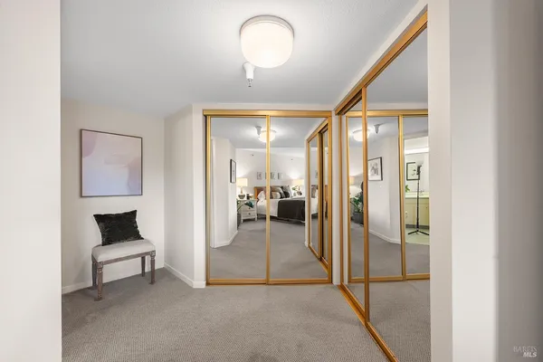 a en suite bathroom with a toilet sink and mirror