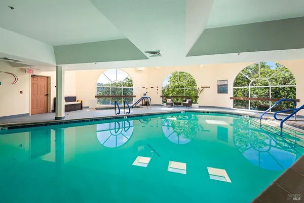 a view of swimming pool with seating area