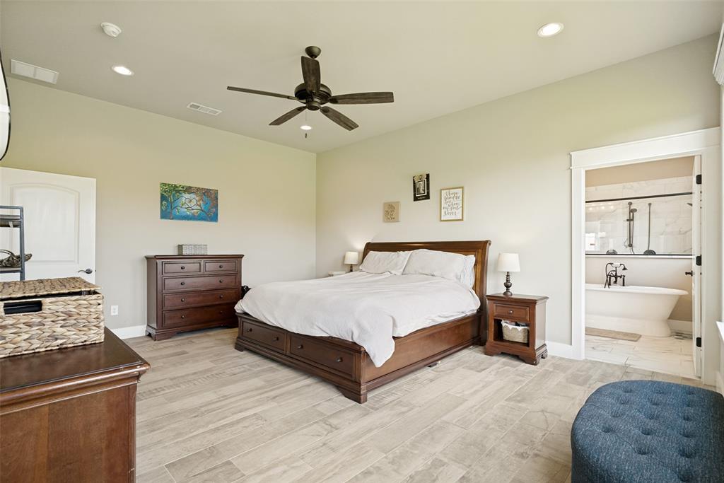 6913 Veal Station Road Weatherford, TX 76085 - Photo 14 of 31 Spacious room featuring wood-look tile flooring, recessed lighting, and a dark-toned ceiling fan