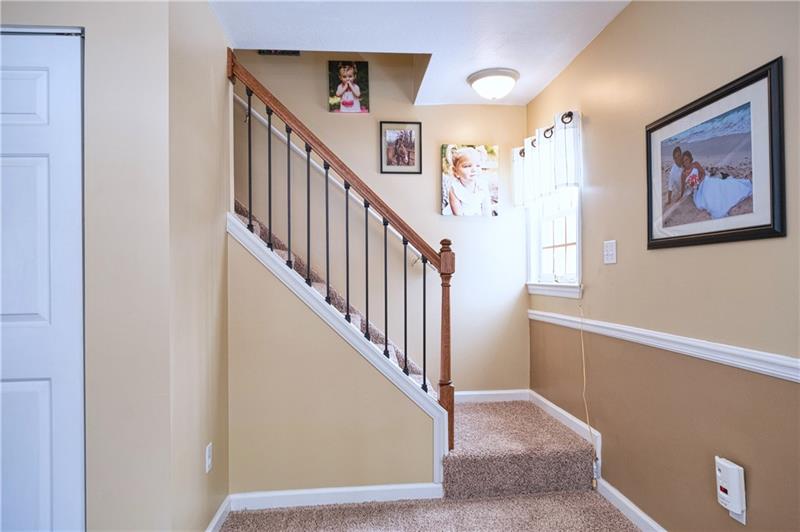 110 Conway Wallrose Road Freedom, PA 15042 - Photo 13 of 25 custom made rod iron staircase leading up to the second floor