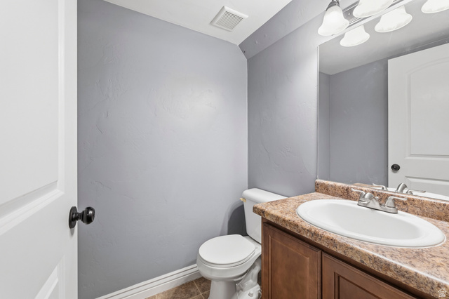 1165 West 100 South Springville, UT 84663 - Photo 22 of 28 Bathroom with vanity and dark tile patterned flooring