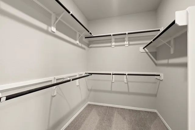 a view of an empty walk in closet