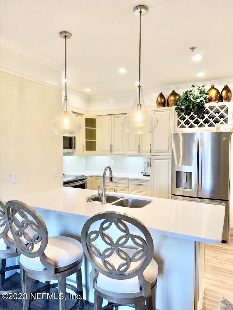 a kitchen with a table and chairs