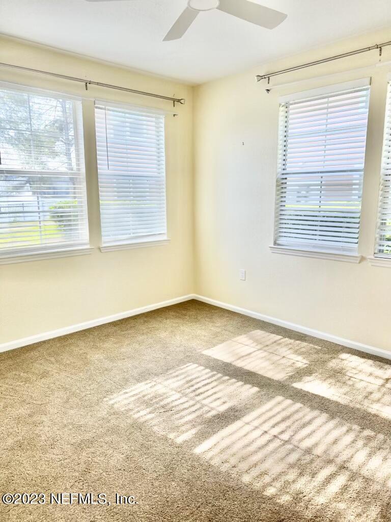 8550 Touchton Road, Unit 1018 Jacksonville, FL 32216 - Photo 11 of 15 a view of an empty room with a window