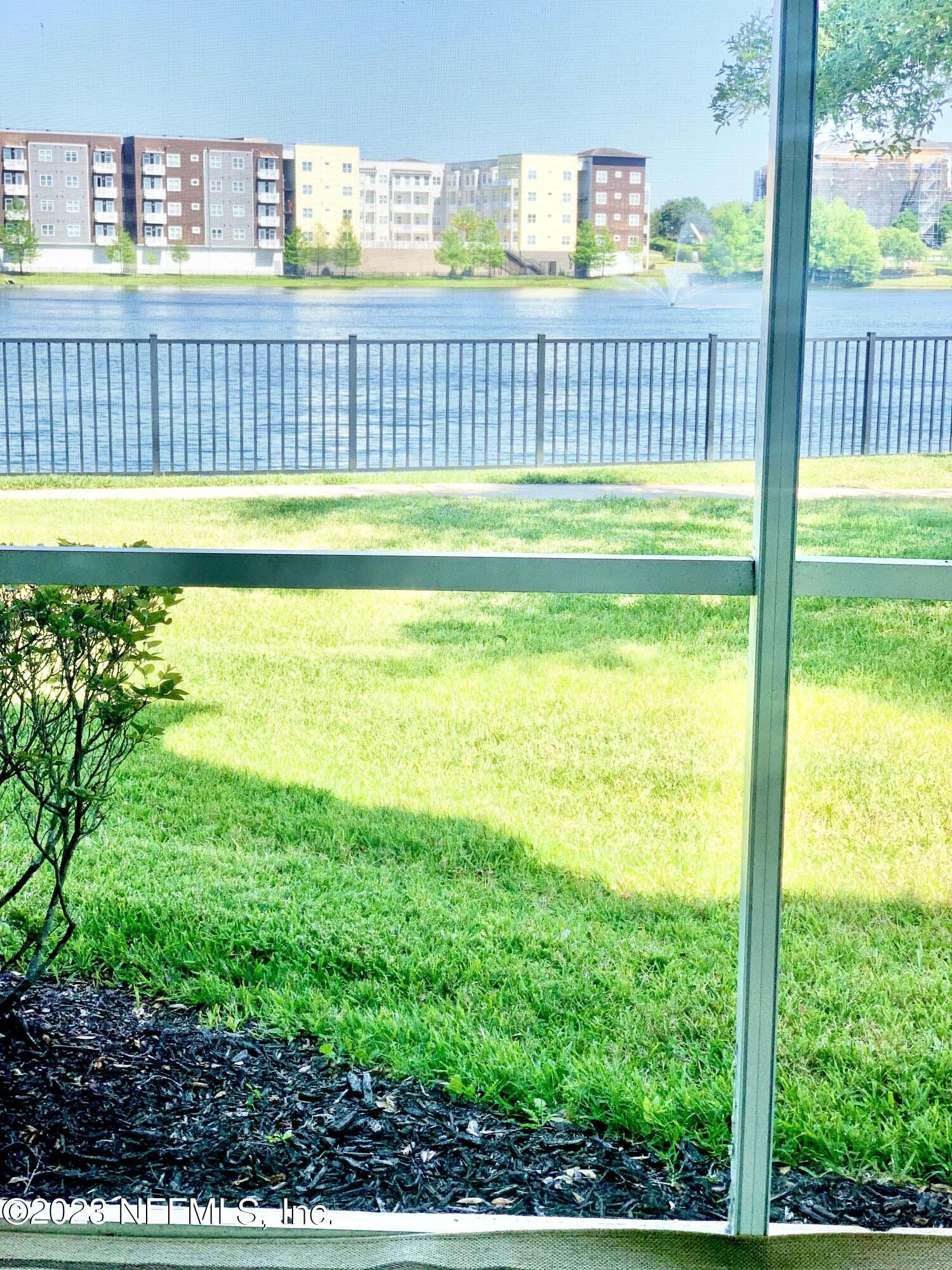 8550 Touchton Road, Unit 1018 Jacksonville, FL 32216 - Photo 13 of 15 a view of a balcony and a yard