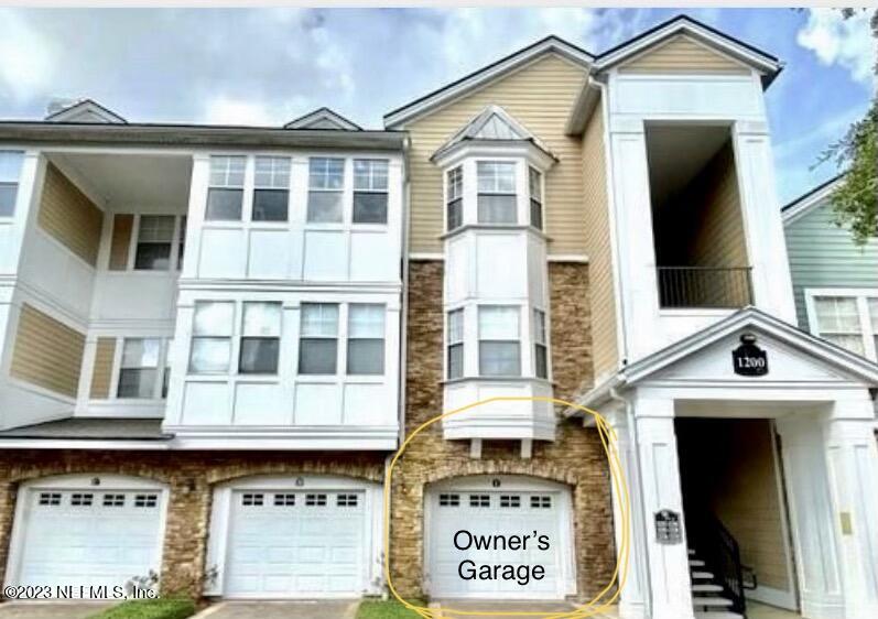 8550 Touchton Road, Unit 1018 Jacksonville, FL 32216 - Photo 14 of 15 a front view of a residential apartment building with a door and a front door