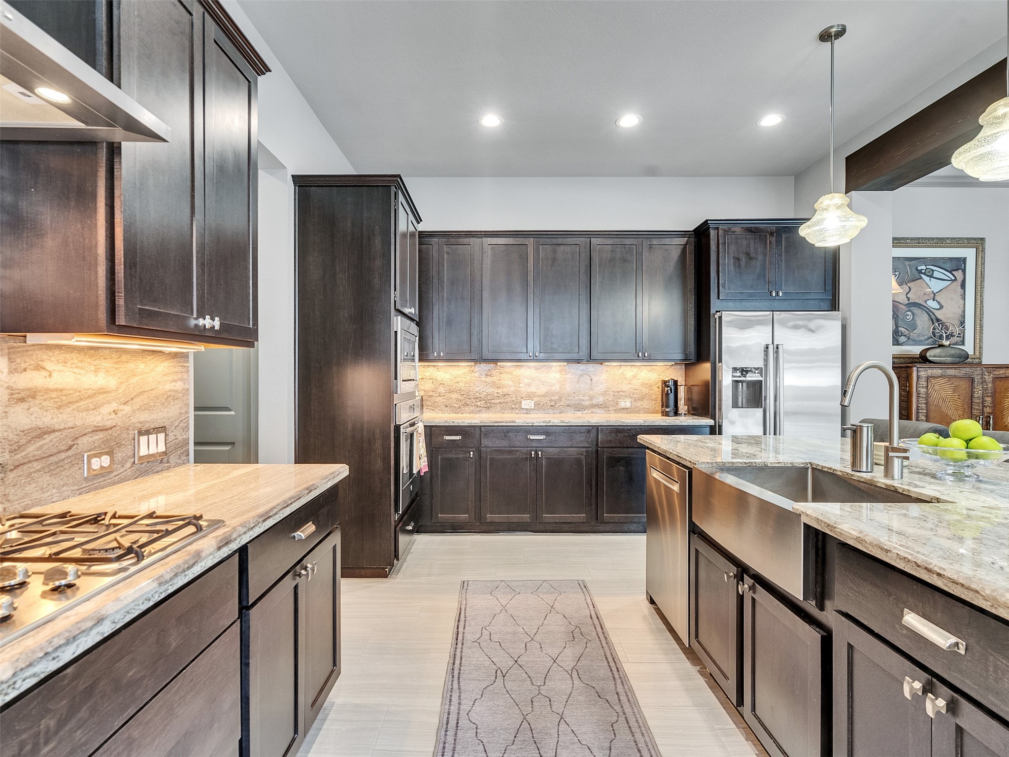 7415 Nantucket Point Lane Spring, TX 77389 - Photo 13 of 49 a kitchen with kitchen island granite countertop stainless steel appliances lots of counter top space cabinets and a sink