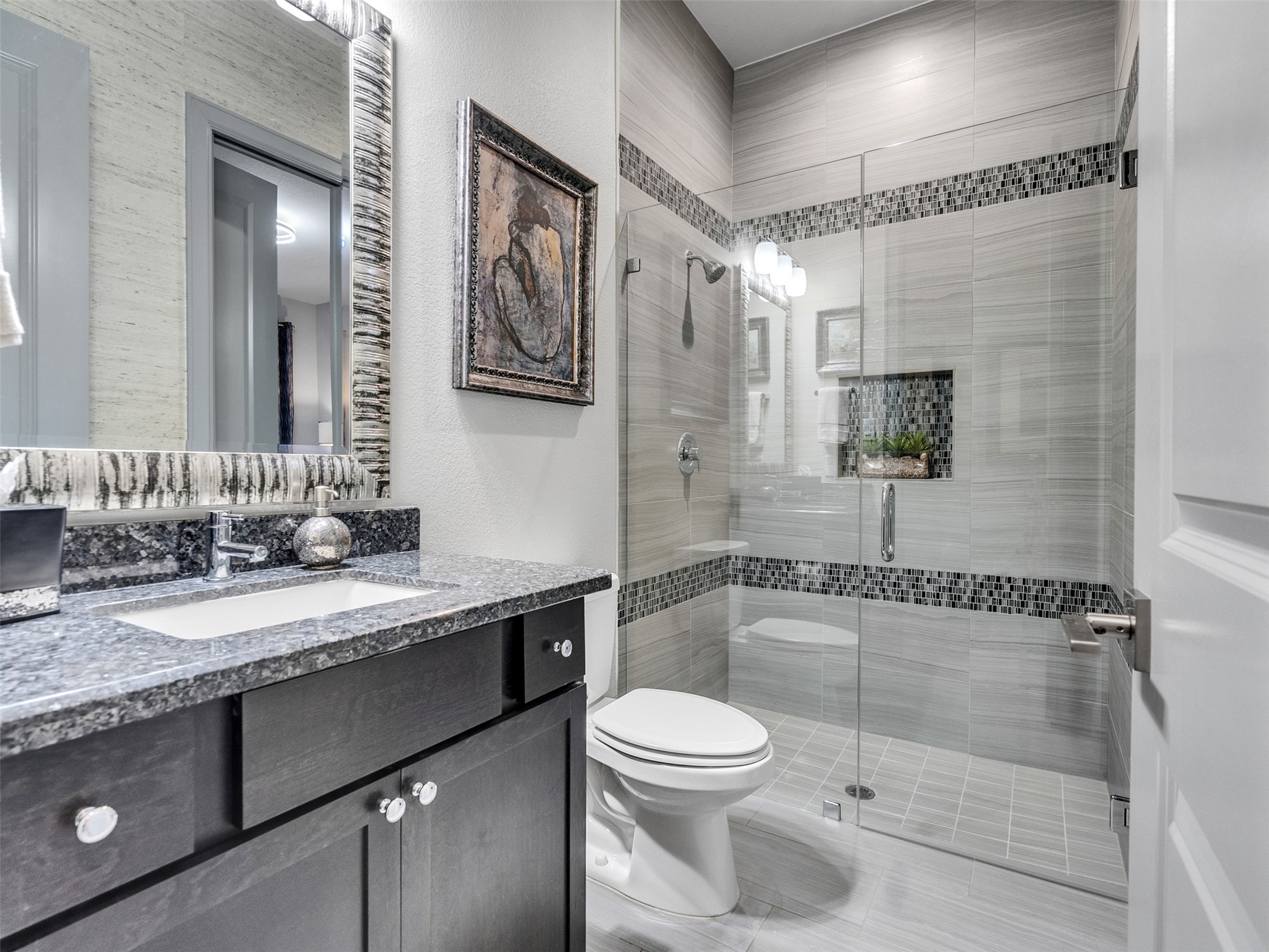 7415 Nantucket Point Lane Spring, TX 77389 - Photo 25 of 49 a bathroom with a granite countertop sink mirror vanity and toilet