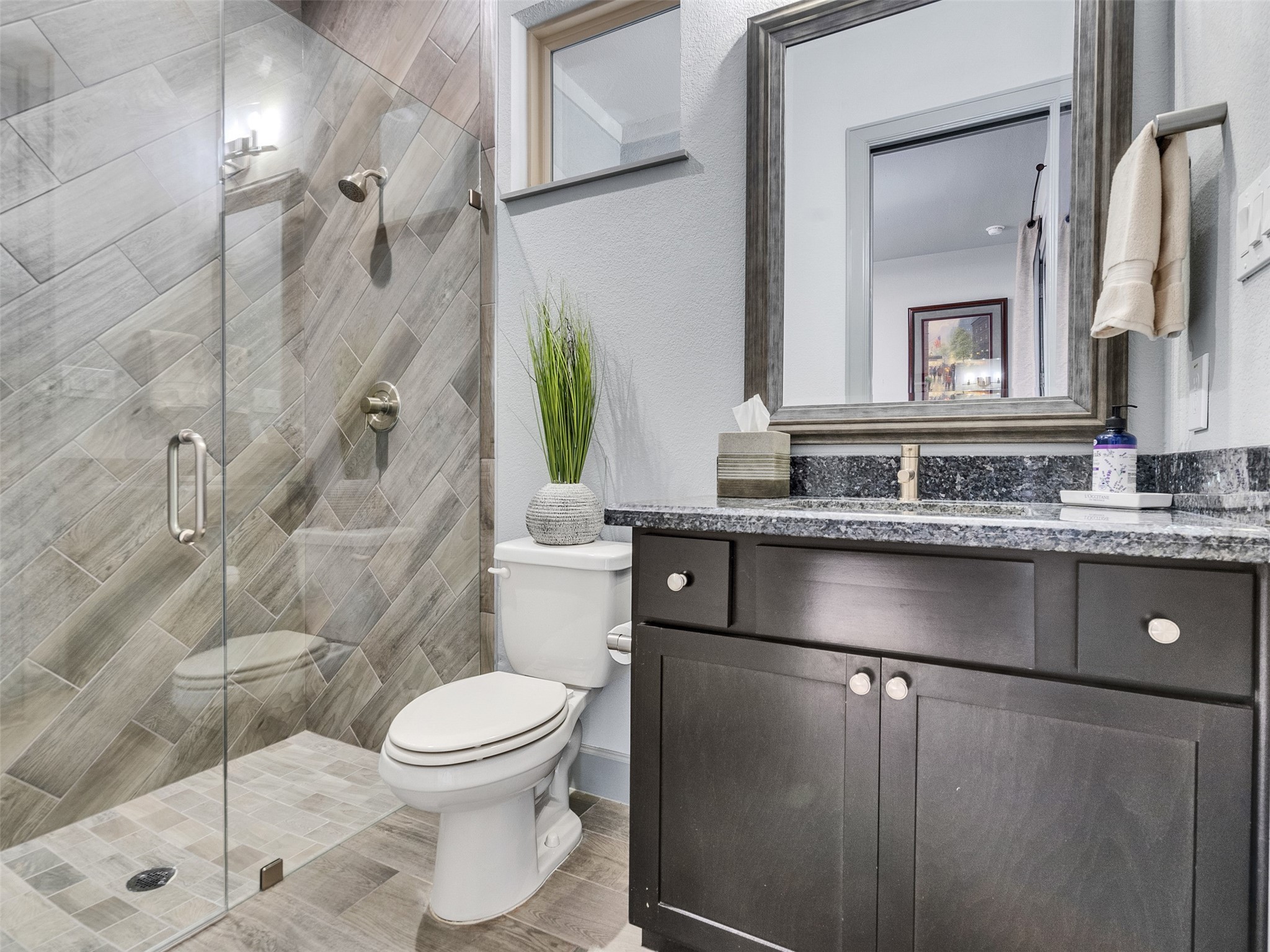 7415 Nantucket Point Lane Spring, TX 77389 - Photo 41 of 49 a bathroom with a granite countertop sink a toilet a mirror and shower