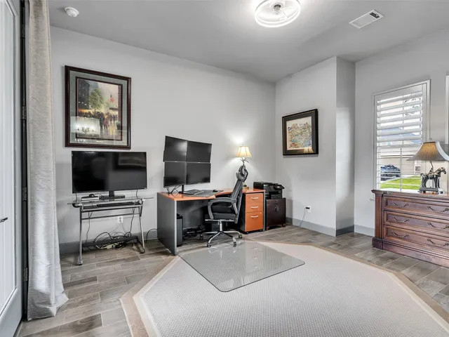 a workspace with furniture and window